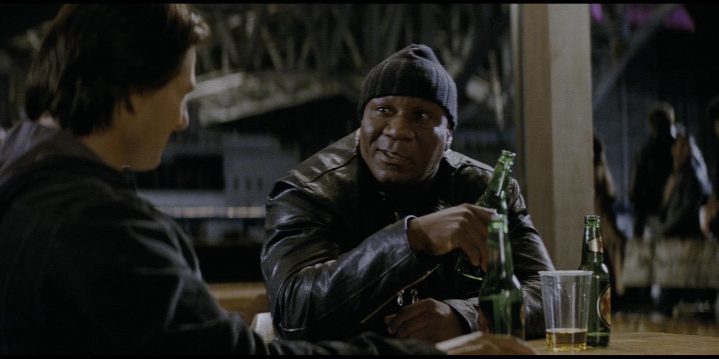 Luther (Ving Rhames) drinking a beer and talking to Ethan (Tom Cruise) in Mission: Impossible - Ghost Protocol
