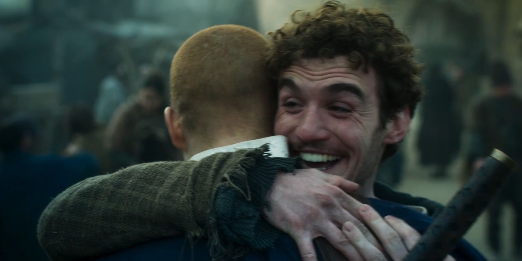 Mat (Dónal Finn) and Rand (Josha Stradowski) hug