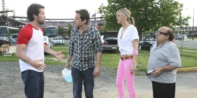 The It's Always Sunny Gang minus Charlie outside a stadium.