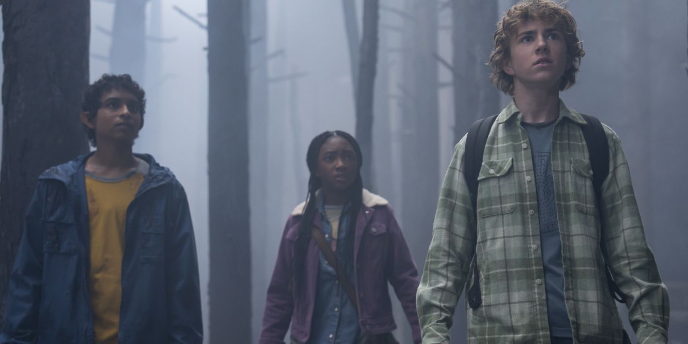 Grover (Aryan Simhadri), Annabeth (Leah Sava Jeffries), and Percy (Walker Scobell) stand in a misty forest in Percy Jackson and the Olympians