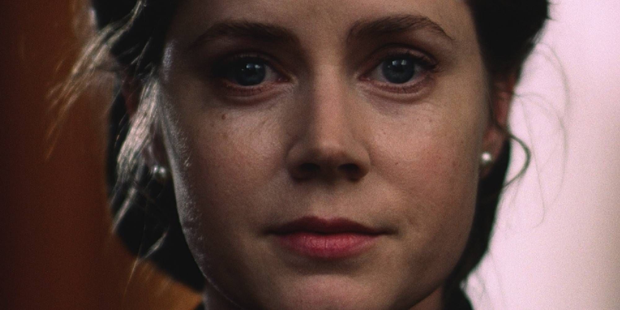 A close-up shot of Amy Adams' face in The Master.