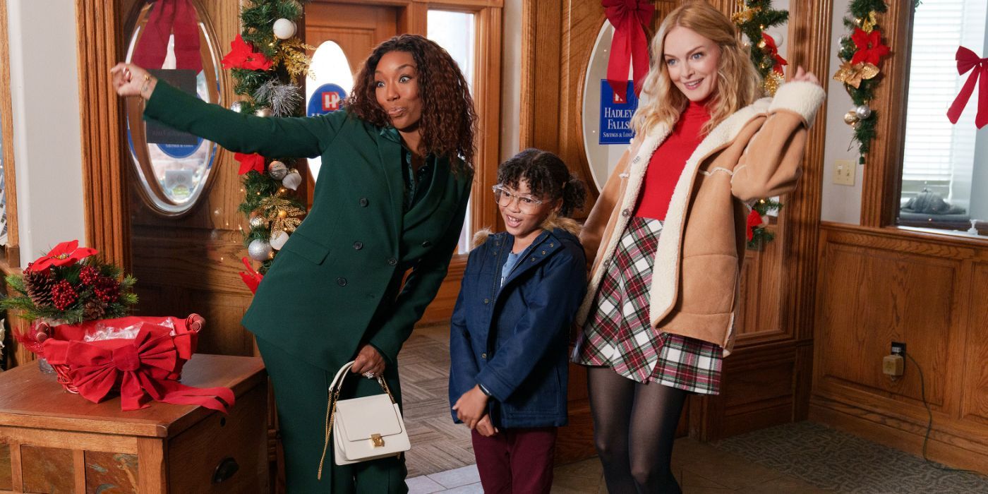 Brandy Norwood and Heather Graham with a child in Best Christmas Ever