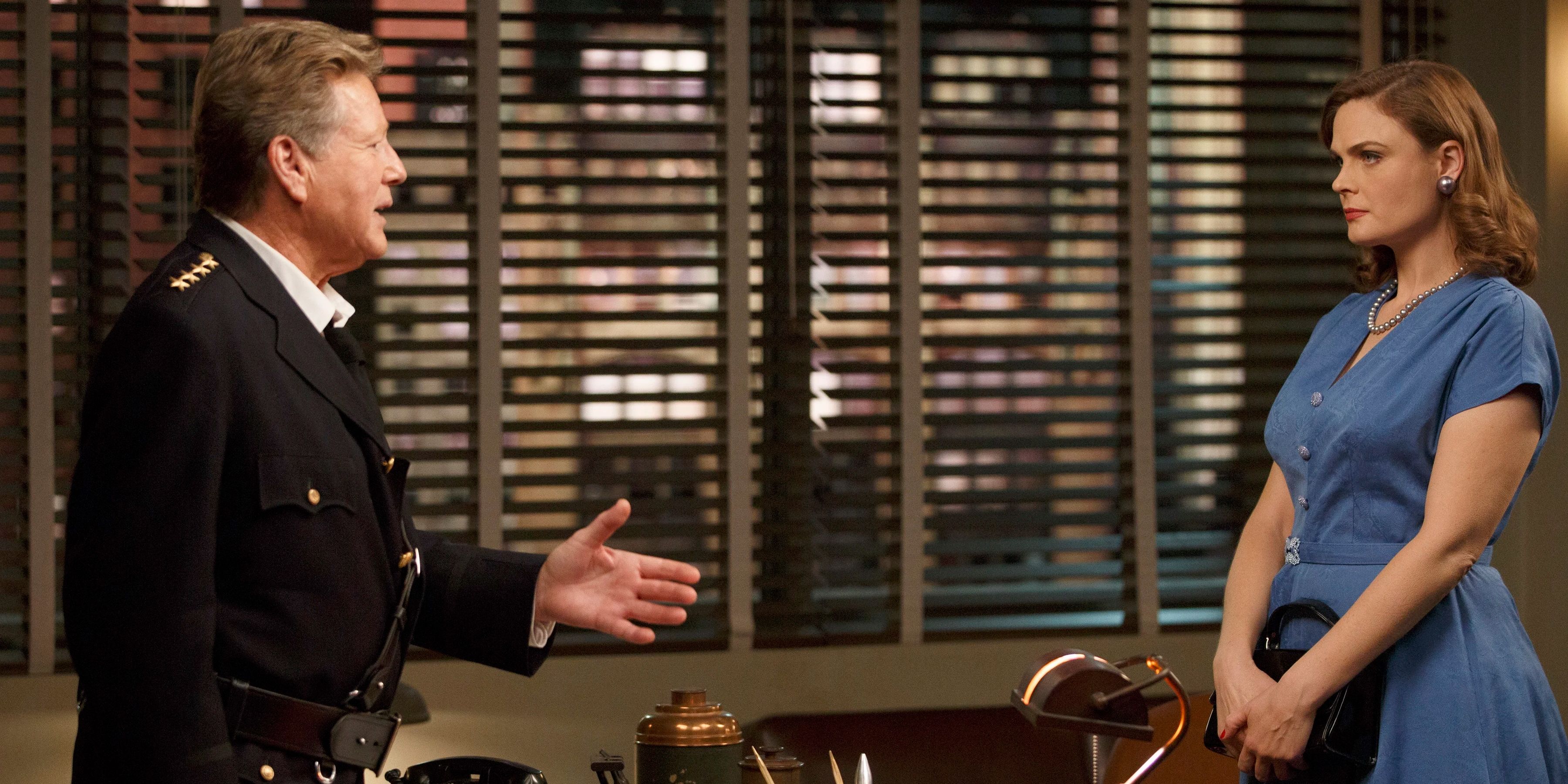 Ryan O'Neal as Max Keenan reaching out to shake Temperance Brennan's (Emily Deschanel) hand in Bones