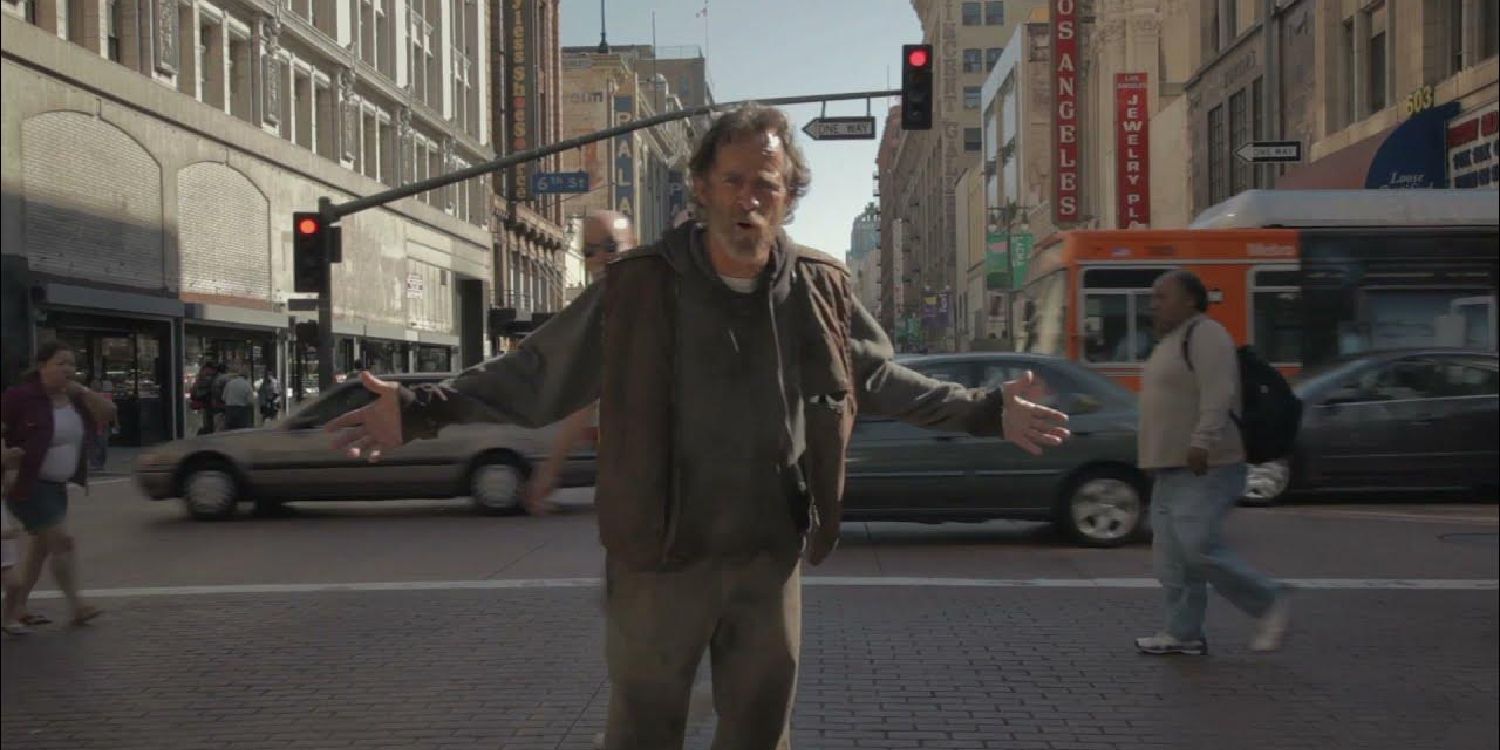 A man walking on the street while talking to the camera in C’est la Vie - 2016