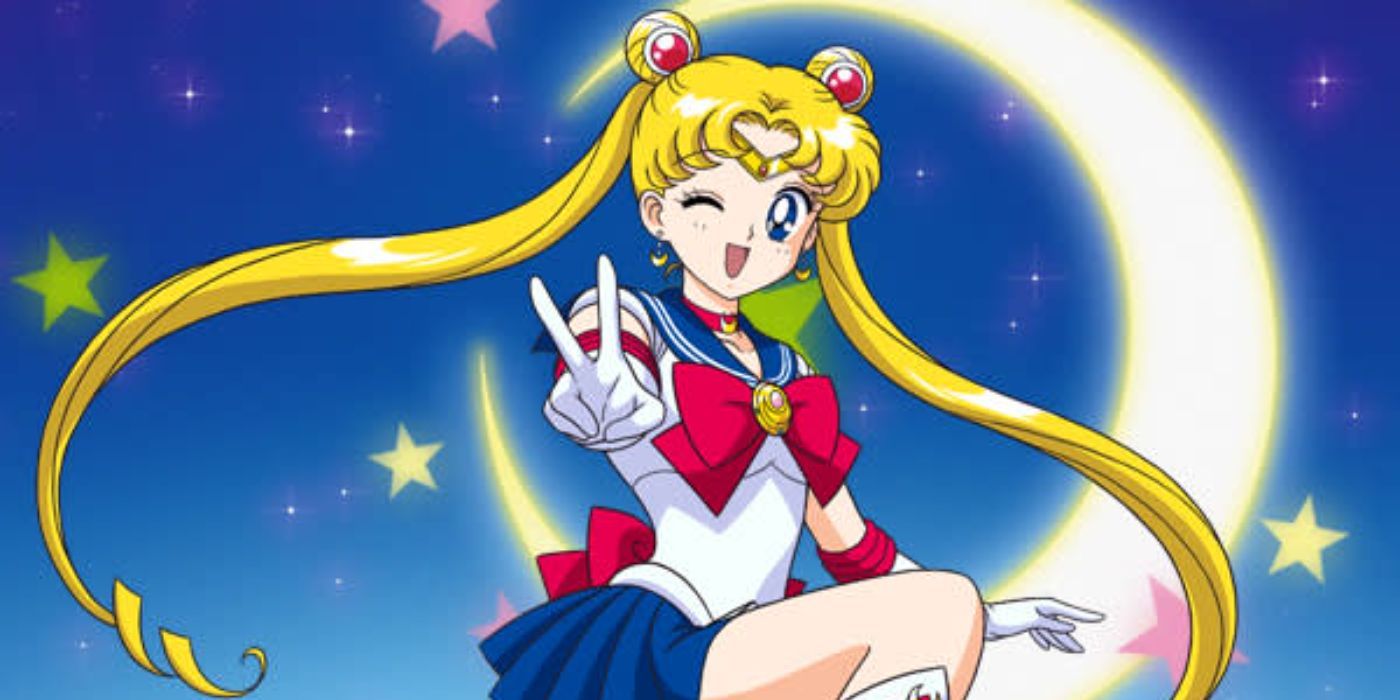 Sailor Moon winking at the camera while doing the peace sign with the moon on the background.