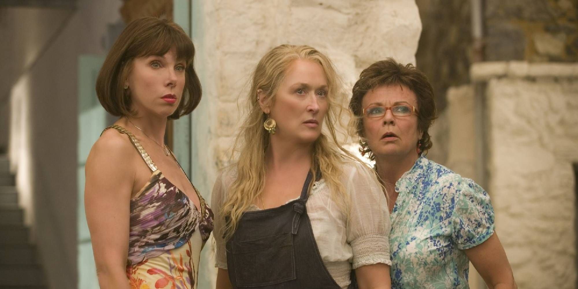 Christine Baranski, Meryl Streep, and Julie Walters standing next to each other while looking surprised in Mamma Mia!