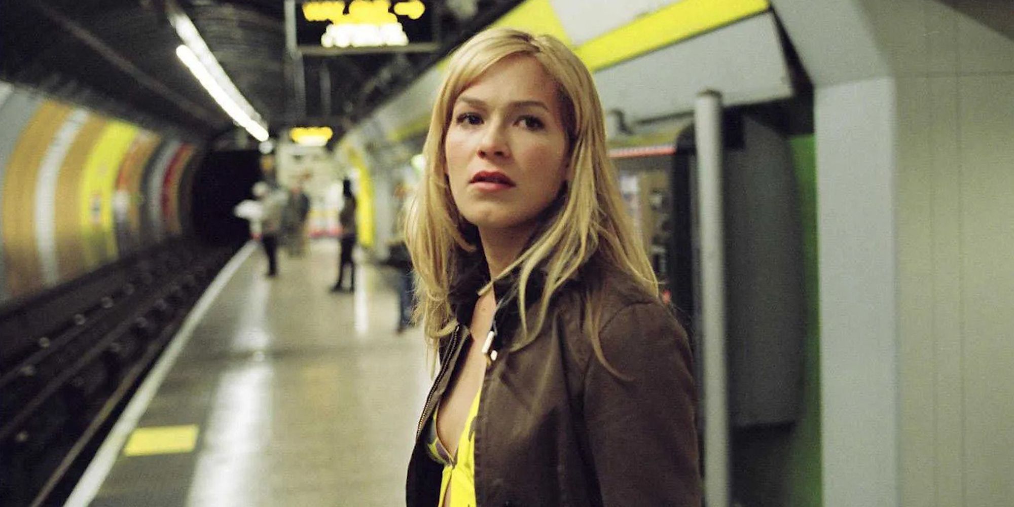 Franka Potente as Kate standing in a subway station in the film Creep.