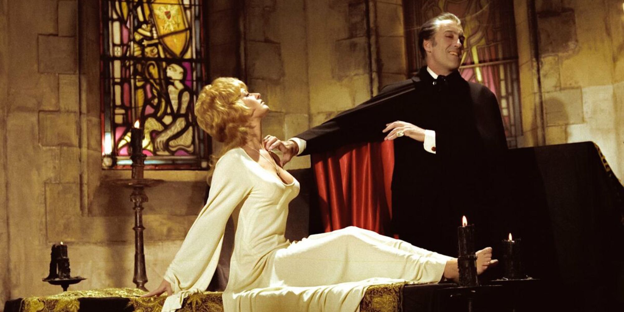 Christopher Lee as Dracula standing over Stephanie Beacham as Jessica Van Helsing in Dracula A.D. 1972