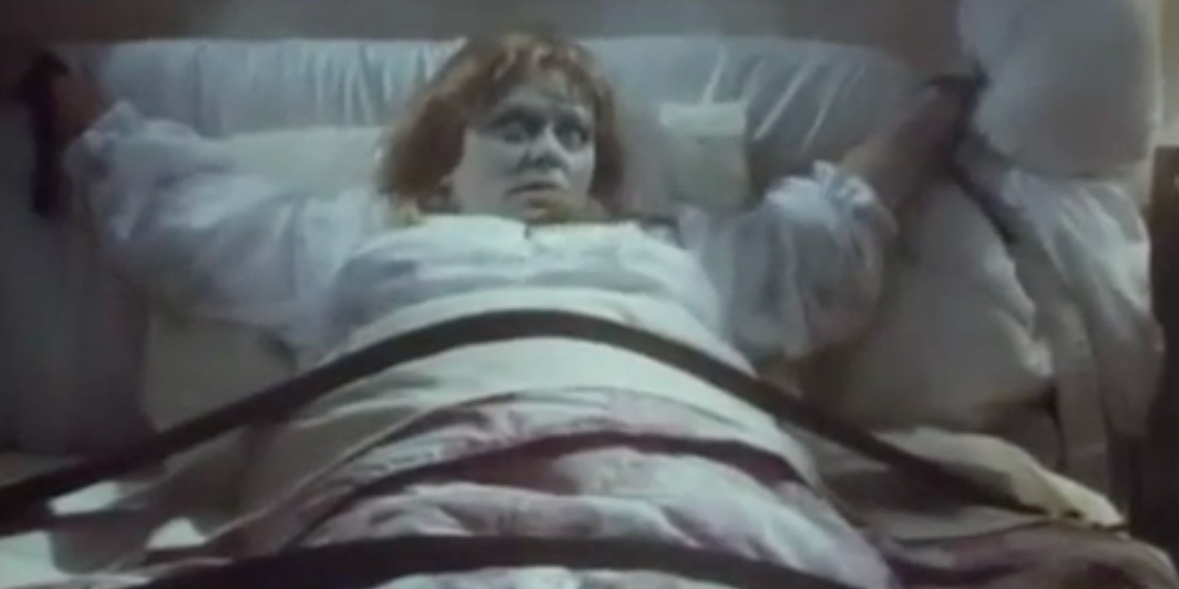A woman possessed by a demon lies tied to the bed in 'French & Saunders'