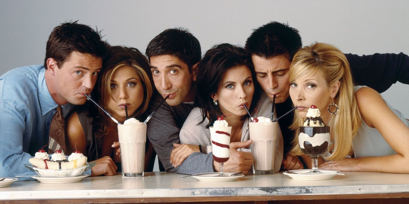 The cast of Friends with Matthew Perry, Jennifer Aniston, David Schwimmer, Courteney Cox, Matt LeBlanc, and Lisa Kudrow sipping from milkshakes together
