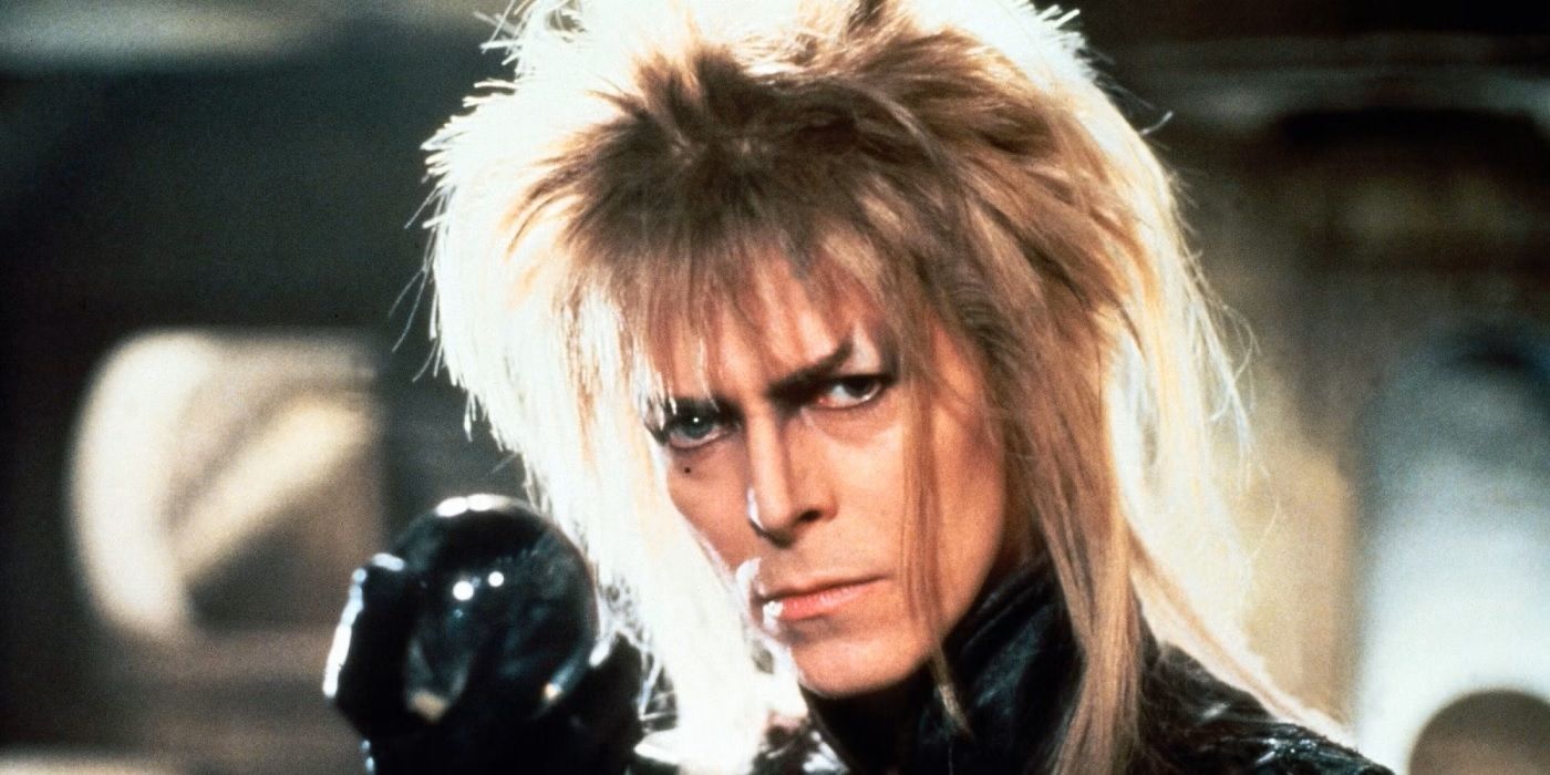 close-up of David Bowie as The Goblin King holding a crystal ball in Labyrinth