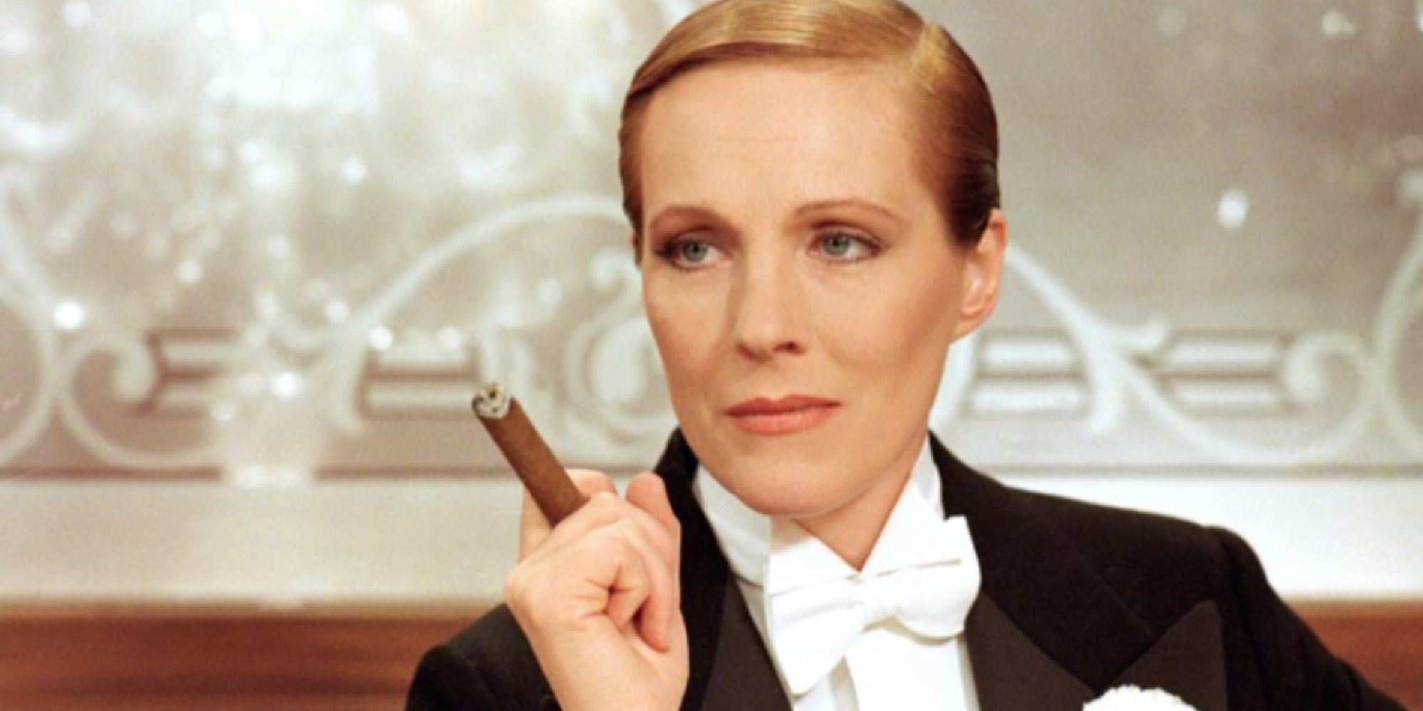 Julie Andrews wearing a tuxedo and holding a cigarette in Victor/Victoria.