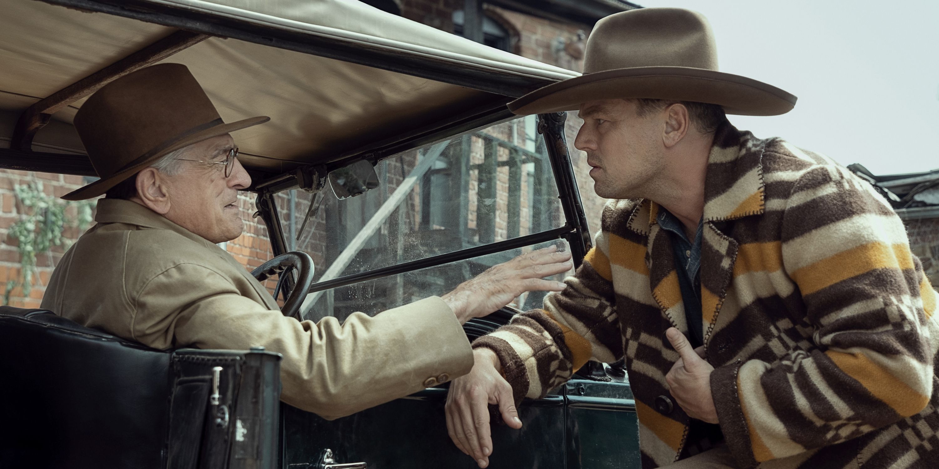 Leonardo DiCaprio as Ernest Burkhart and Robert De Niro as William Hale in Killers of the Flower Moon