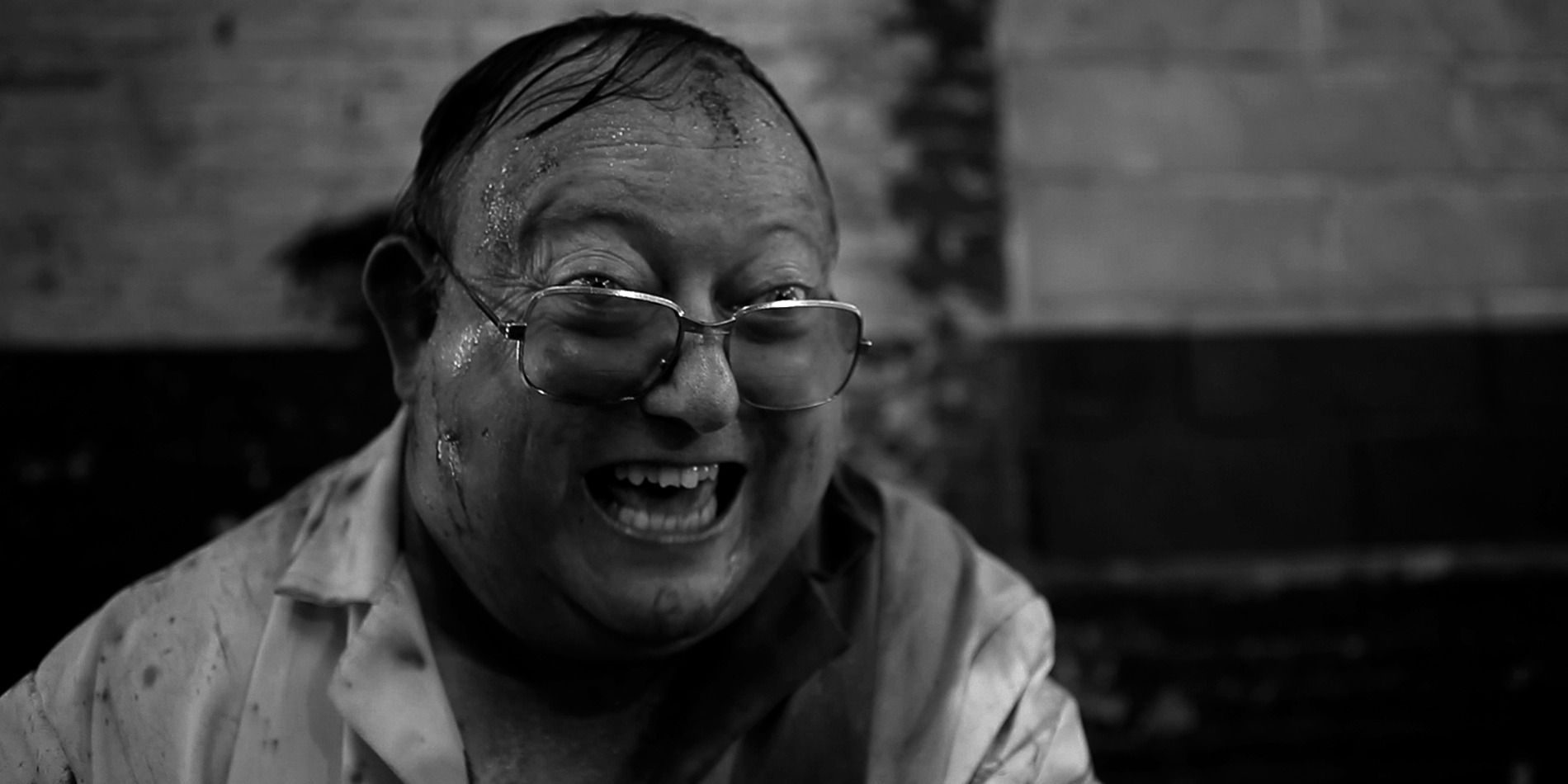 Laurence R. Harvey in 'The Human Centipede II', laughing maniacally