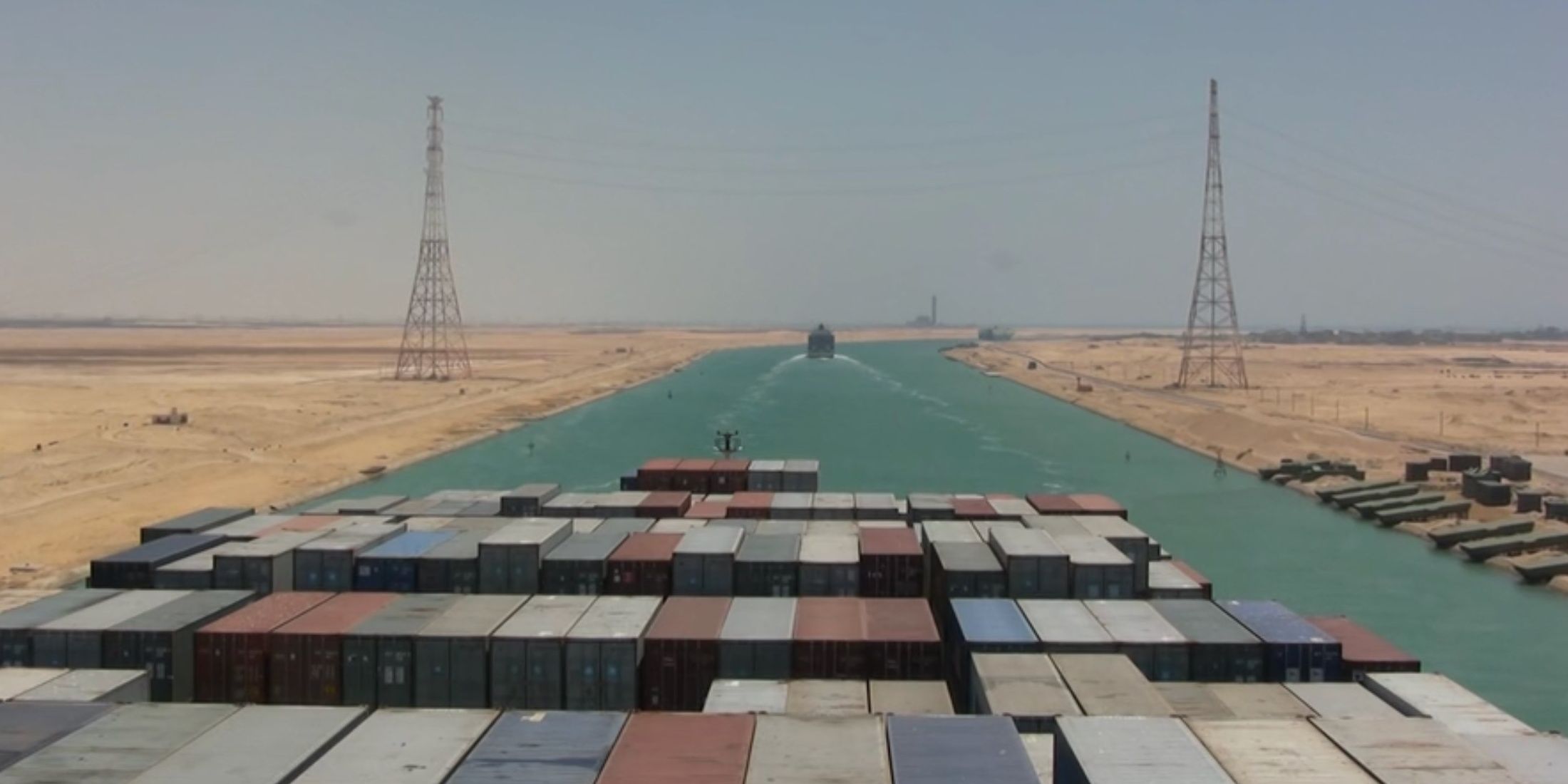 Shipping containers sailing on a river in Logistics
