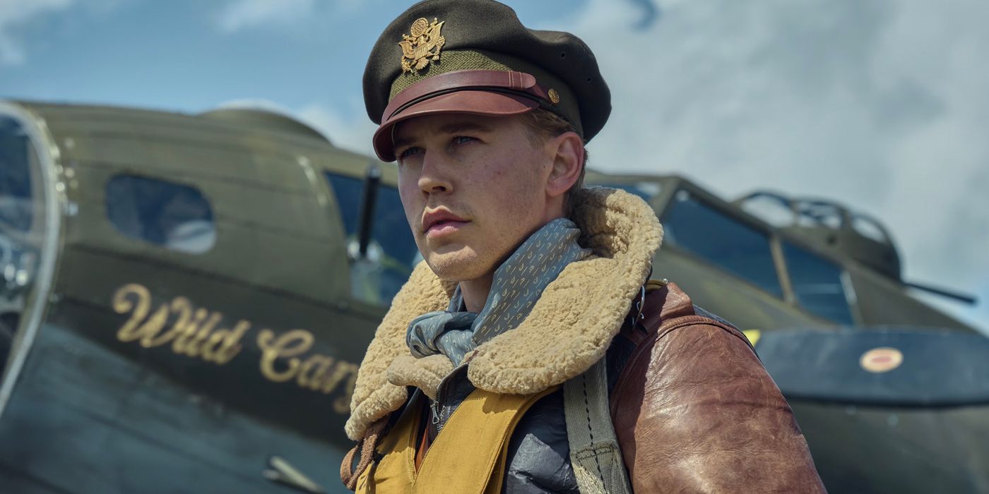 Austin Butler S Major Gale Claven looking off into the distance with a plane in the background at Masters of Air