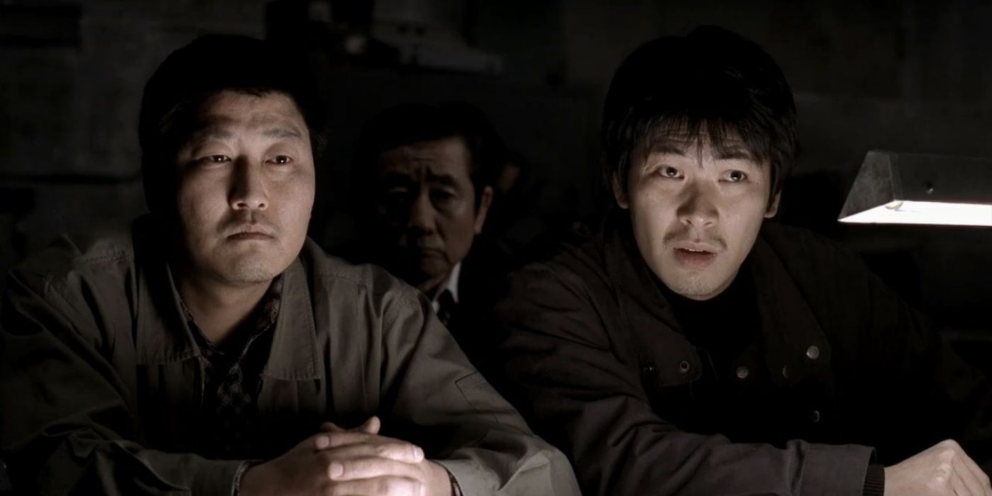 Detectives Park Doo-man and Seo Tae-yoon, portrayed by Song Kang-ho and Kim Sang-kyung, respectively, interrogating in the movie Memories of a Murder