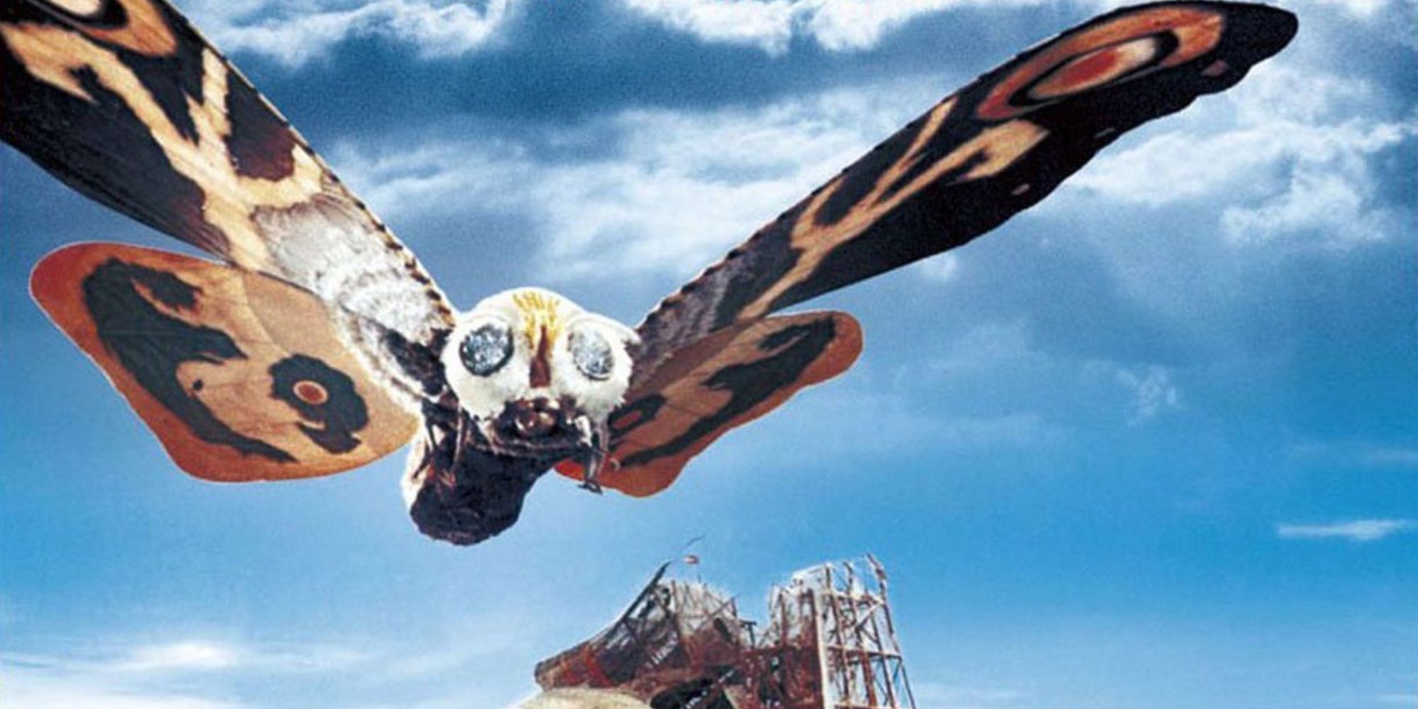 Mothra flying across the blue sky in Mothra 1961