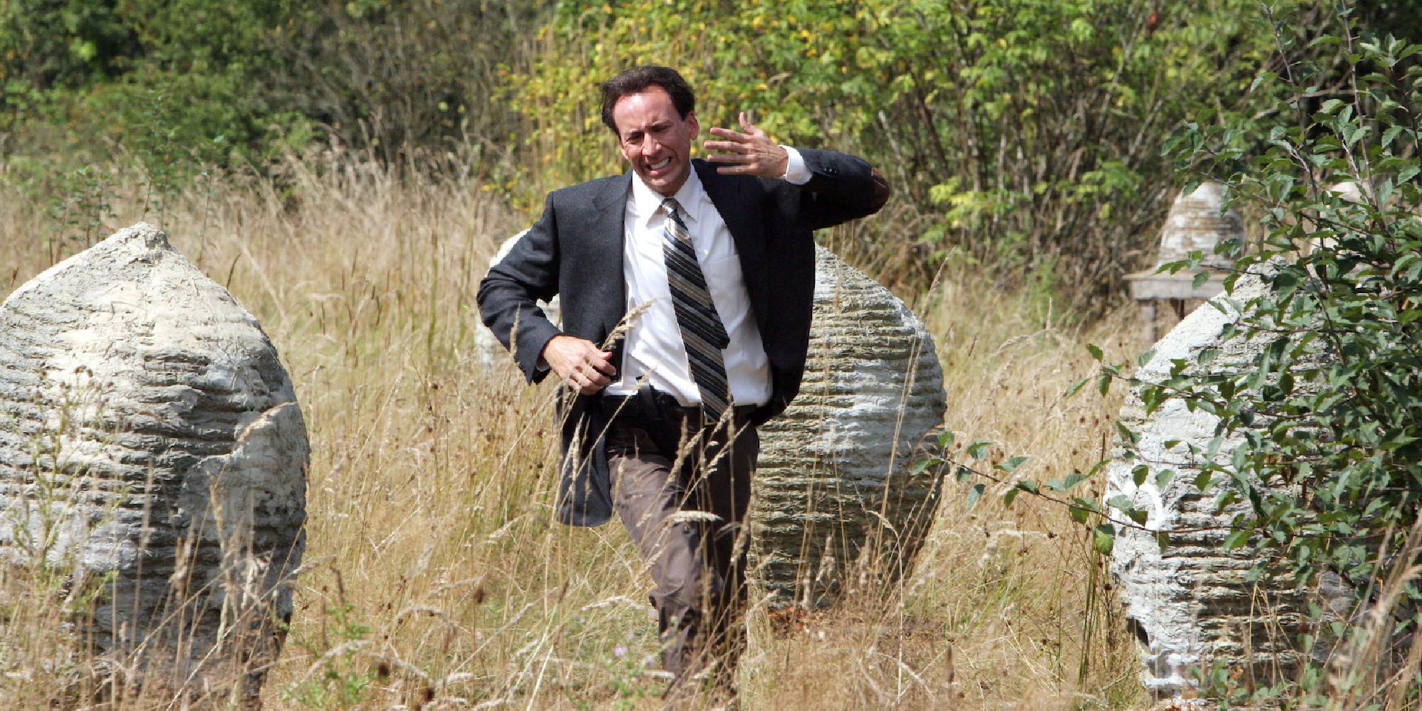 Edward Malus running in an open field in The Wicker Man