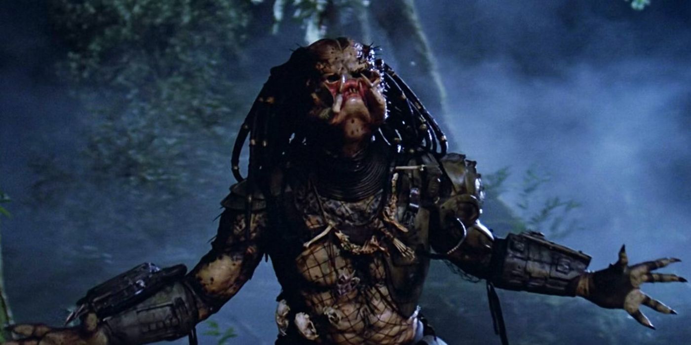 The Predator with his arms held out in Predator (1987)