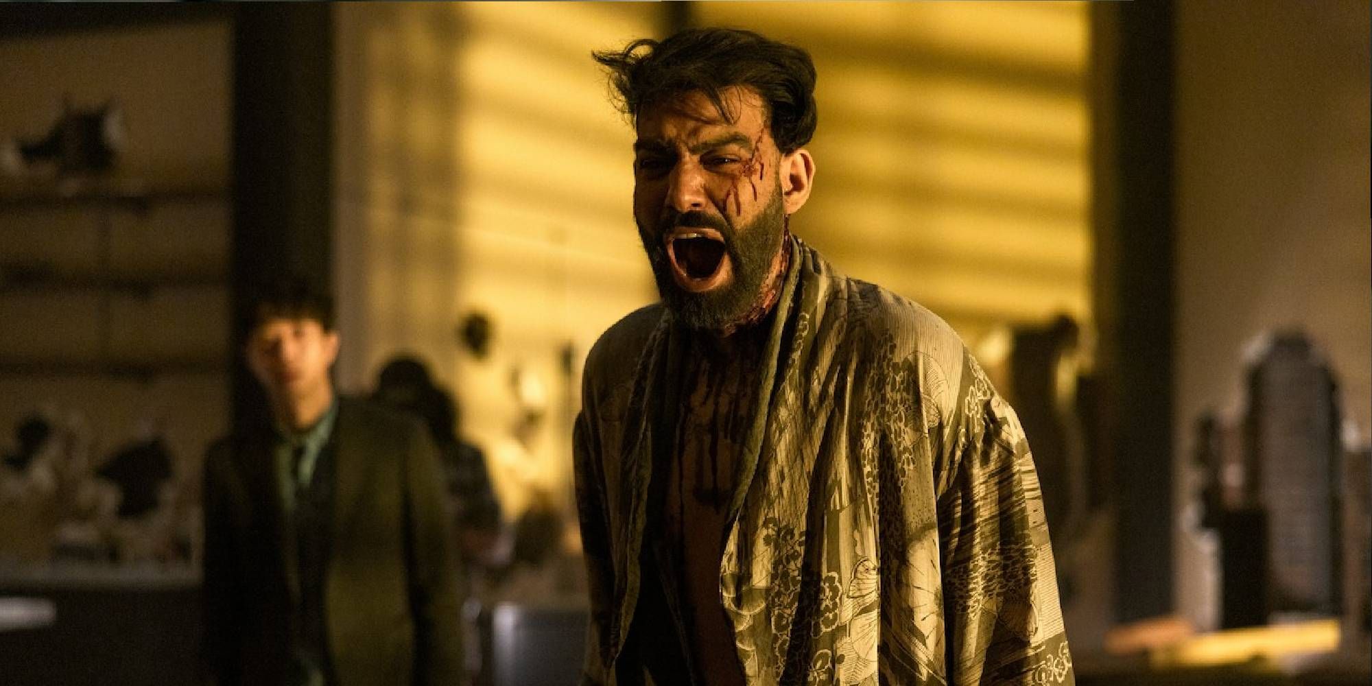 A medium shot of Rahul Kohli screaming as Napoleon Usher in Netflix's The Fall of the House of Usher.