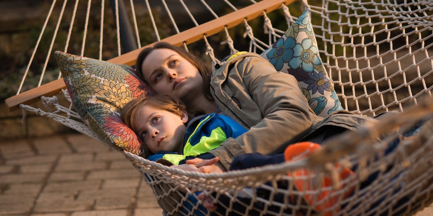 Brie Larson as Joy and Jacob Tremblay as Jack sit in a hamock in Room