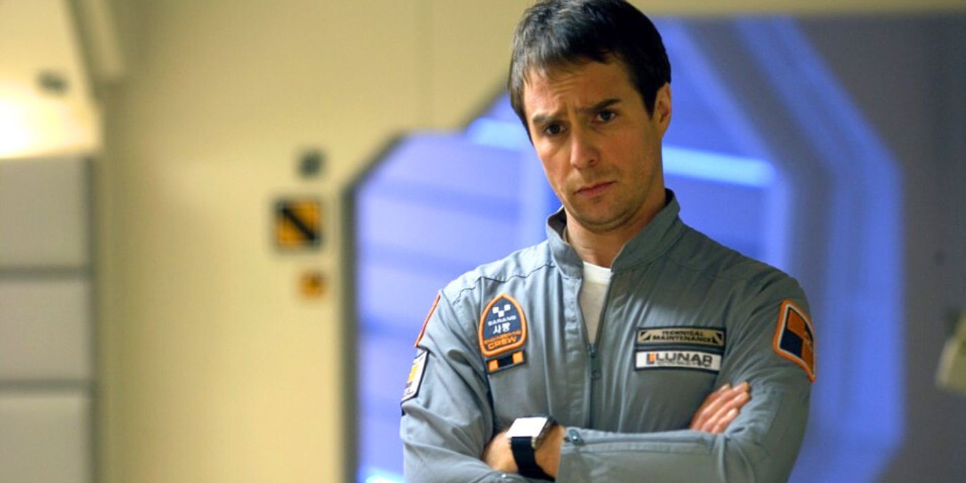 Sam Rockwell standing with his arms crossed on a spacecraft in Moon (2009)