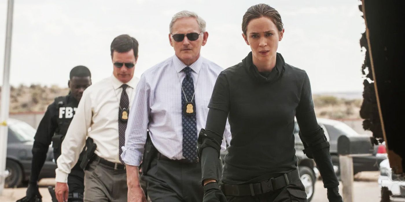 Kate Macer and Dave Jennings walking into a building in Sicario 