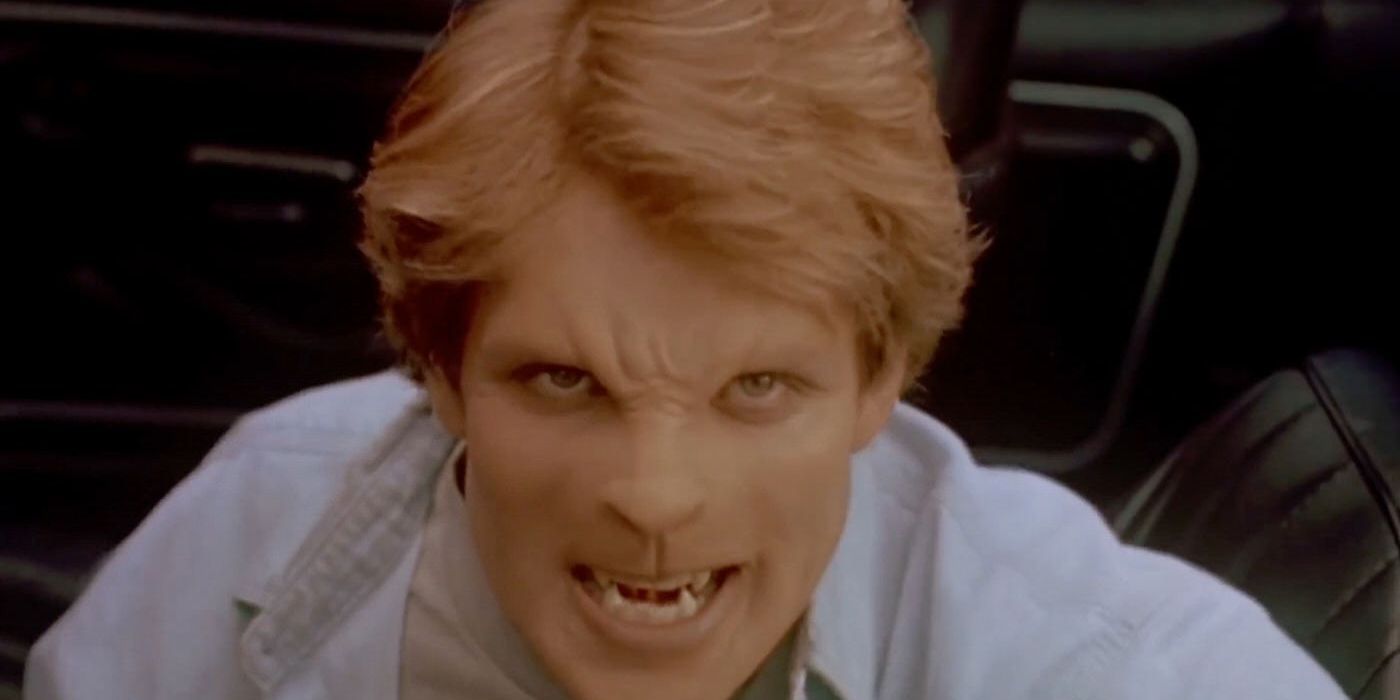 A humanoid man with cat features bearing his fangs in Sleepwalkers
