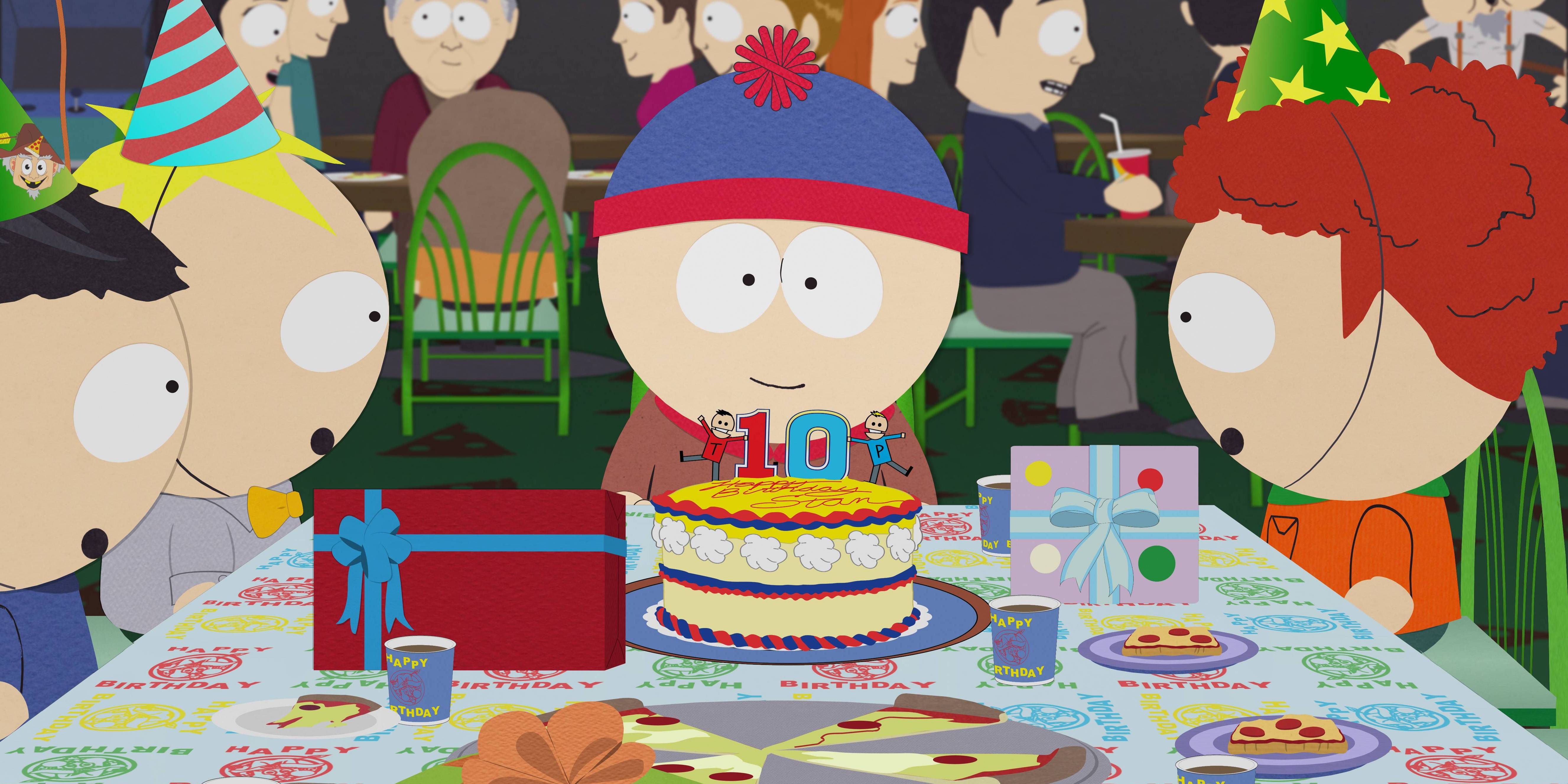 Stan Marsh, voiced by Trey Parker, sits behind his birthday cake on South Park.