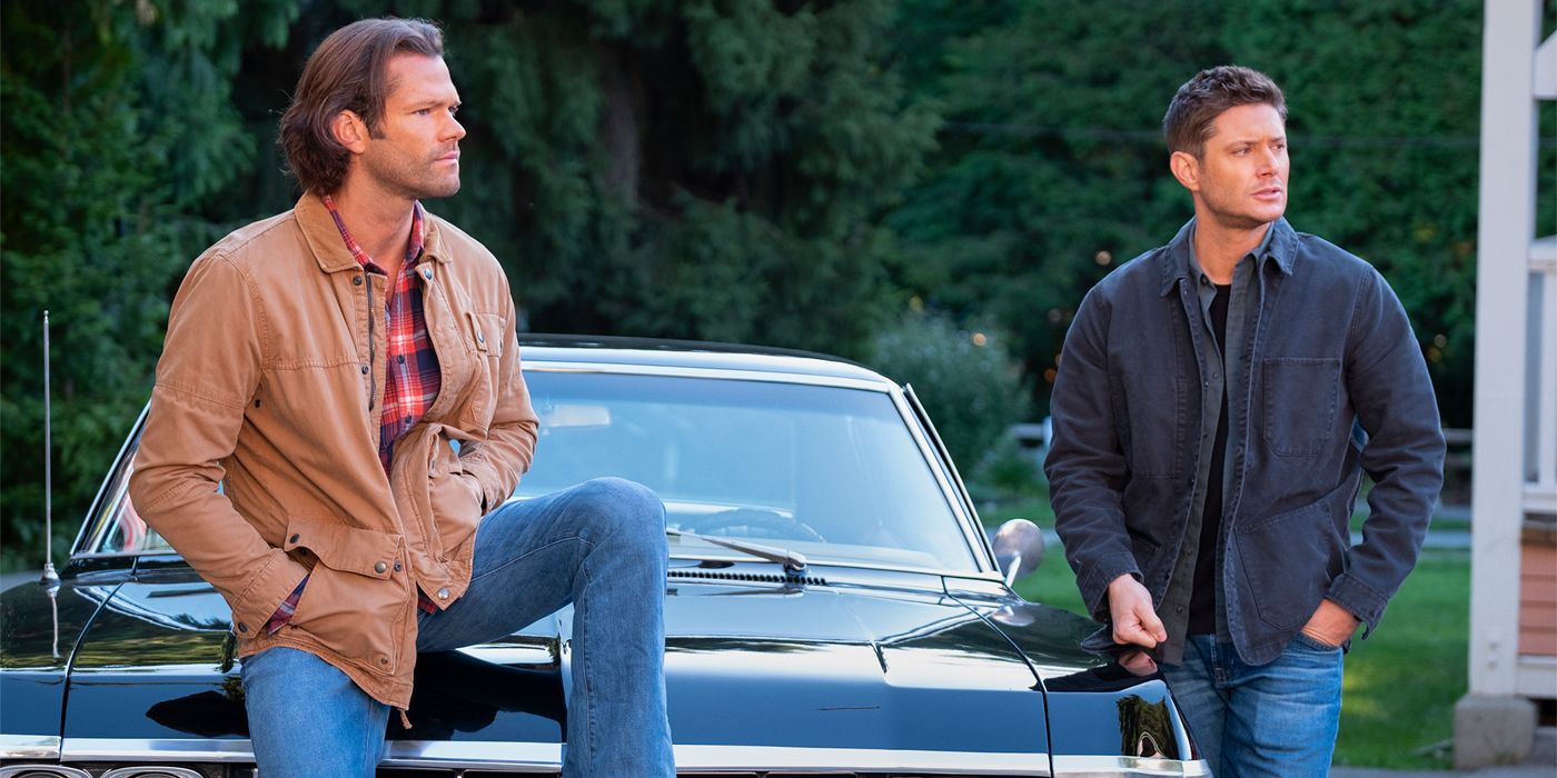 Jared Padalecki and Jensen Ackles as Sam and Dean Winchester, sitting on the Chevy Impala in Supernatural