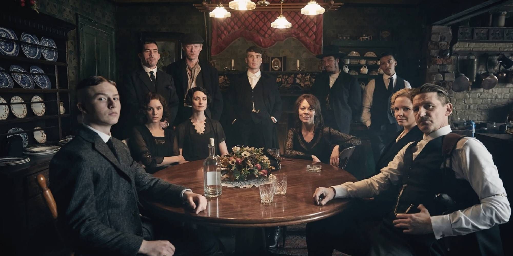 From left to right: Harry Kirton as Finn Shelby, Sophie Rundle as Ada Shelby, Packy Lee as Johnny Dogs, Ned Dennehy as Charlie Strong, Natasha O'Keeffe as Lizzie Stark, Cillian Murphy as Tommy Shelby, Helen McCrory as Polly Gray, Benjamin Zephaniah as Jeremiah, Daryl McCormack as Isaiah, Kate Phillips as Linda Shelby, and Paul Anderson as Arthur Shelby.