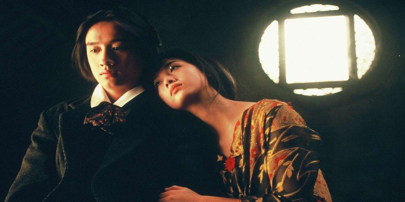 A woman leans on a man&rsquo;s shoulder with a small window behind them in The Phantom Lover.