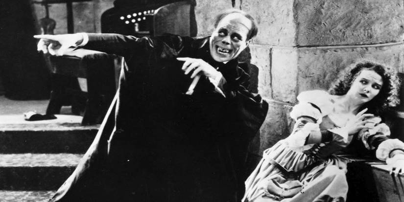 Lon Chaney as The Phantom tries to coax Mary Philbin as Christine in The Phantom of the Opera (1925).