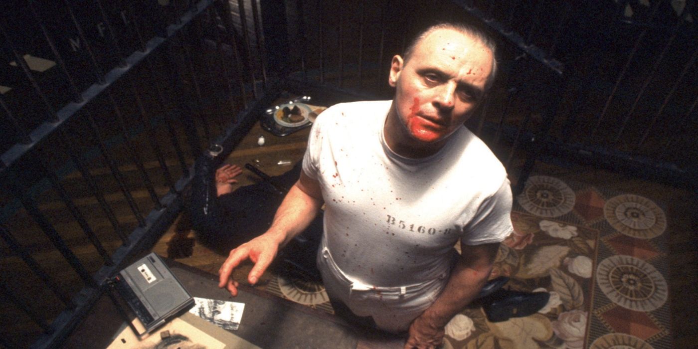 Hannibal Lecter with blood on his face in his jail cell looking up in Silence of the Lambs