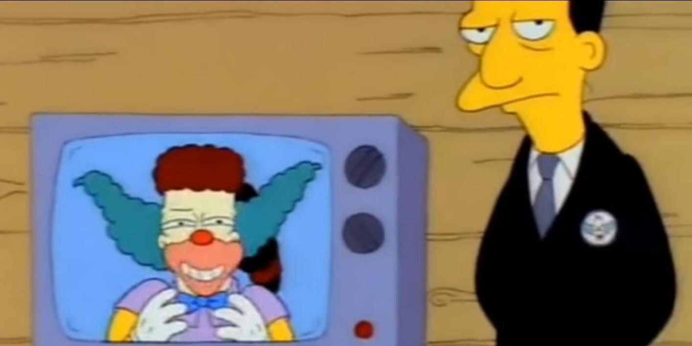A man standing next to a television showing Krusty the Clown in The Simpsons