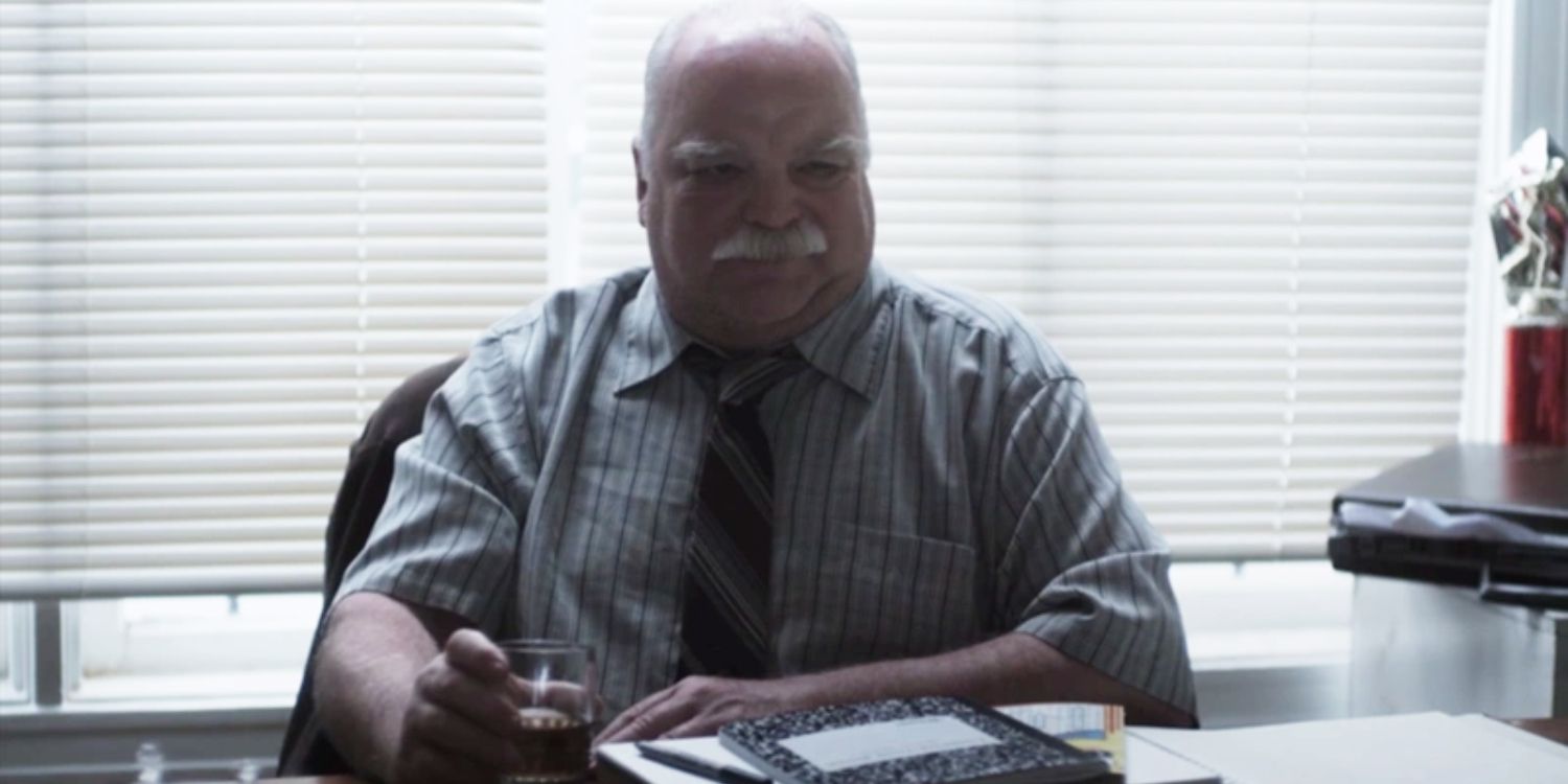 Detective Bing Shooster sitting behind his desk in The Turtle's Head