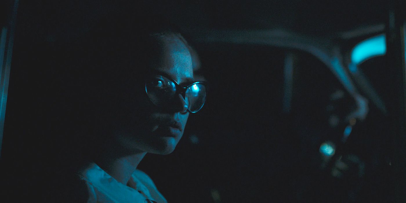 A girl is scared in the car in a still from The Vast of Night