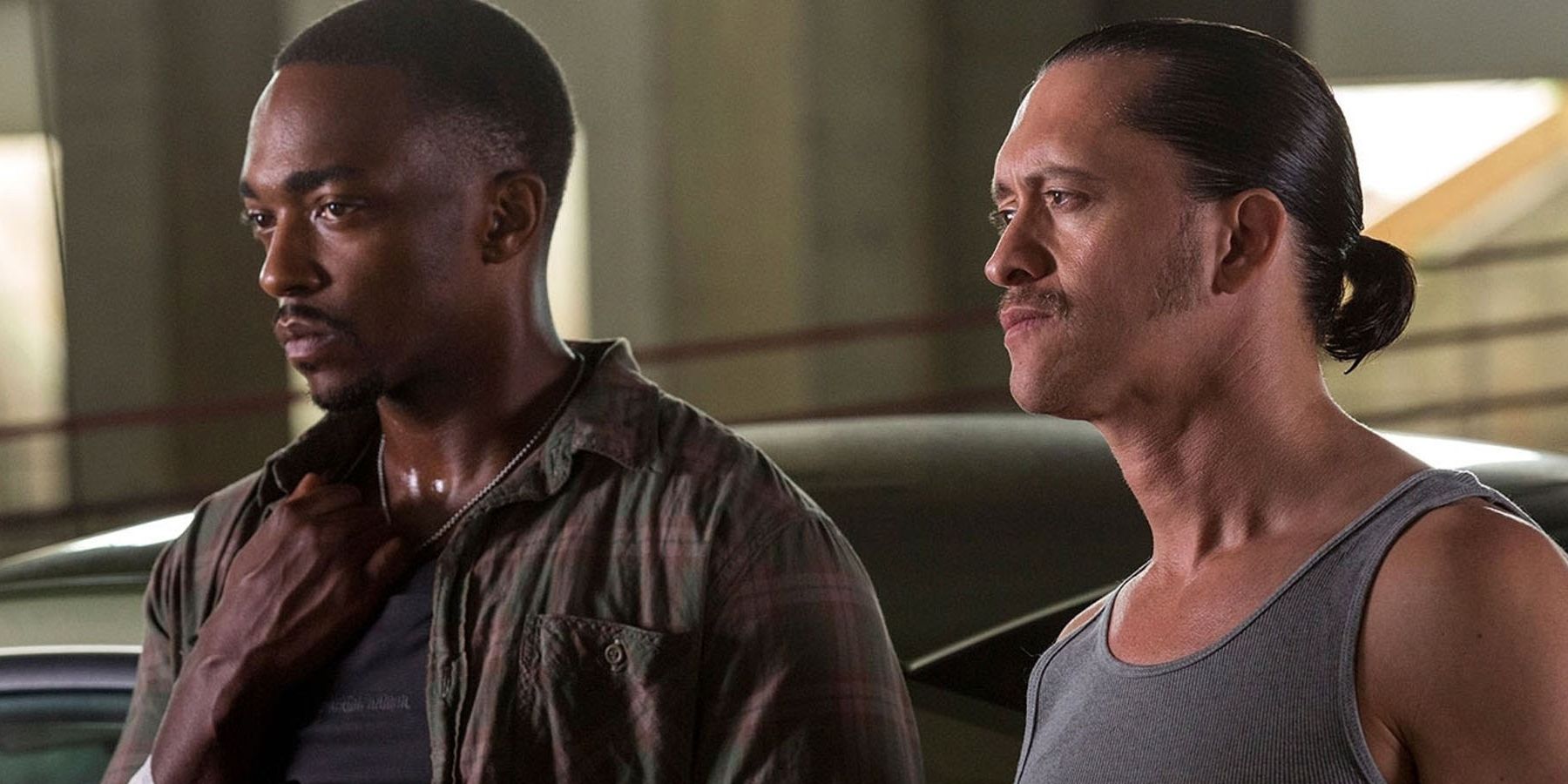 Anthony Mackie and Clifton Collins Jr. as Marcus Belmont and Franco Rodriguez looking intently in the same direction in Triple 9
