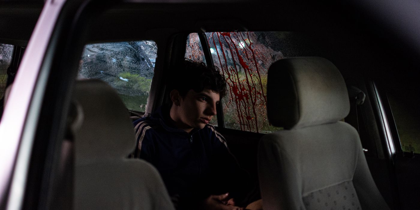 Emilio Vodanovich sitting in a car in Demián Rugna’s When Evil Lurks.