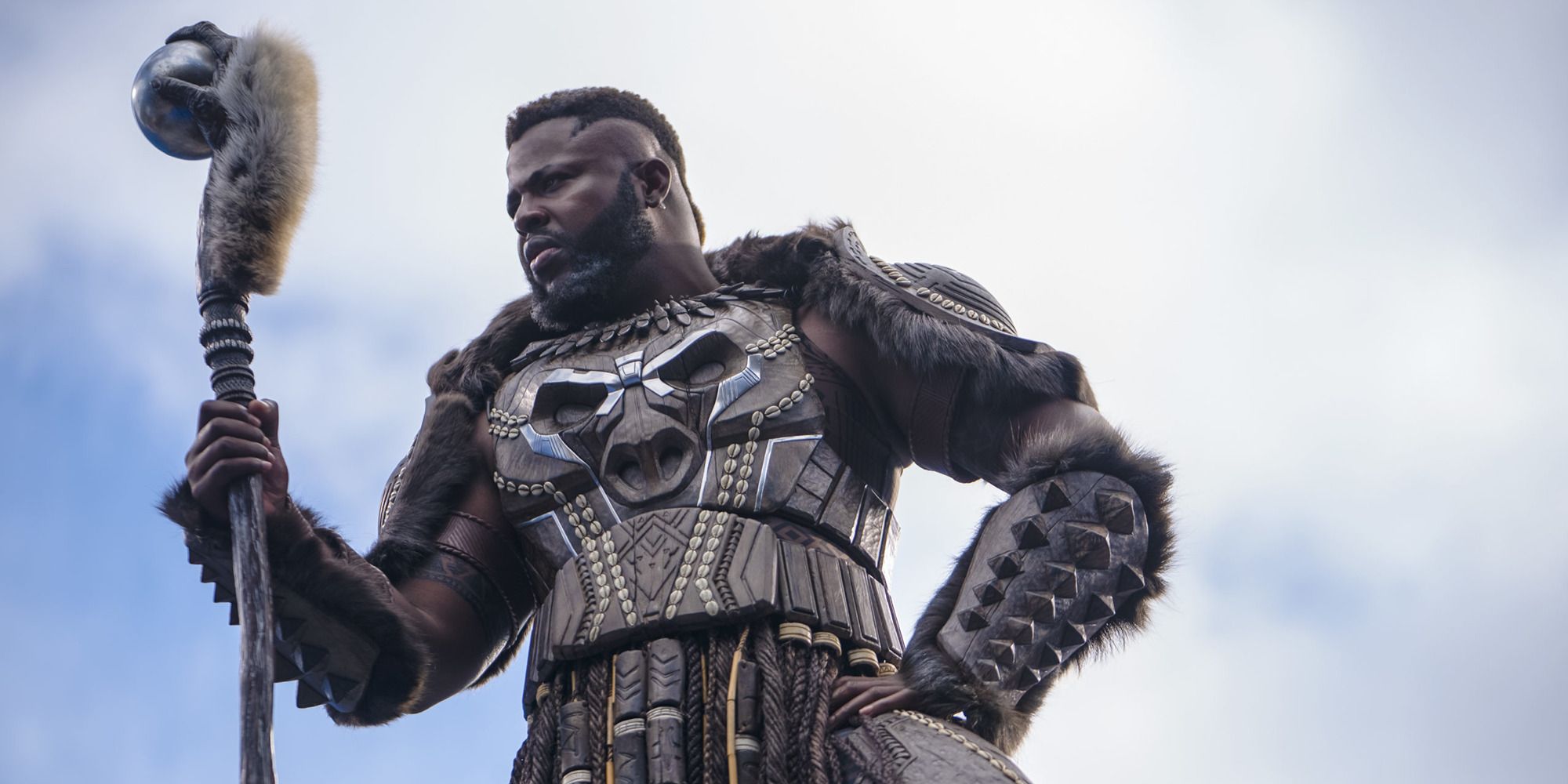 Winston Duke as M&rsquo;Baku with a staff, wearing an intricate ceremonial armor in &lsquo;Black Panther: Wakanda Forever&rsquo;