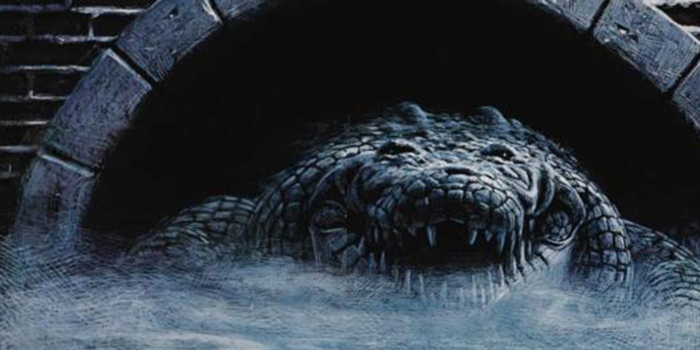 An alligator coming out of a sewer