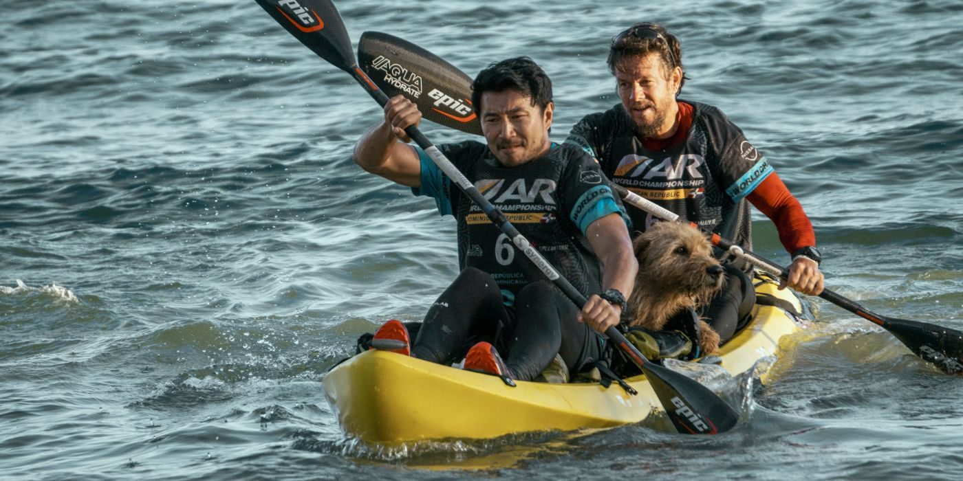 Mark Wahlburg and Simu Liu in 'Arthur the King' rowing a boat