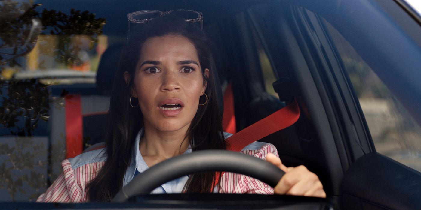 Gloria looking shocked while driving a car in Barbie