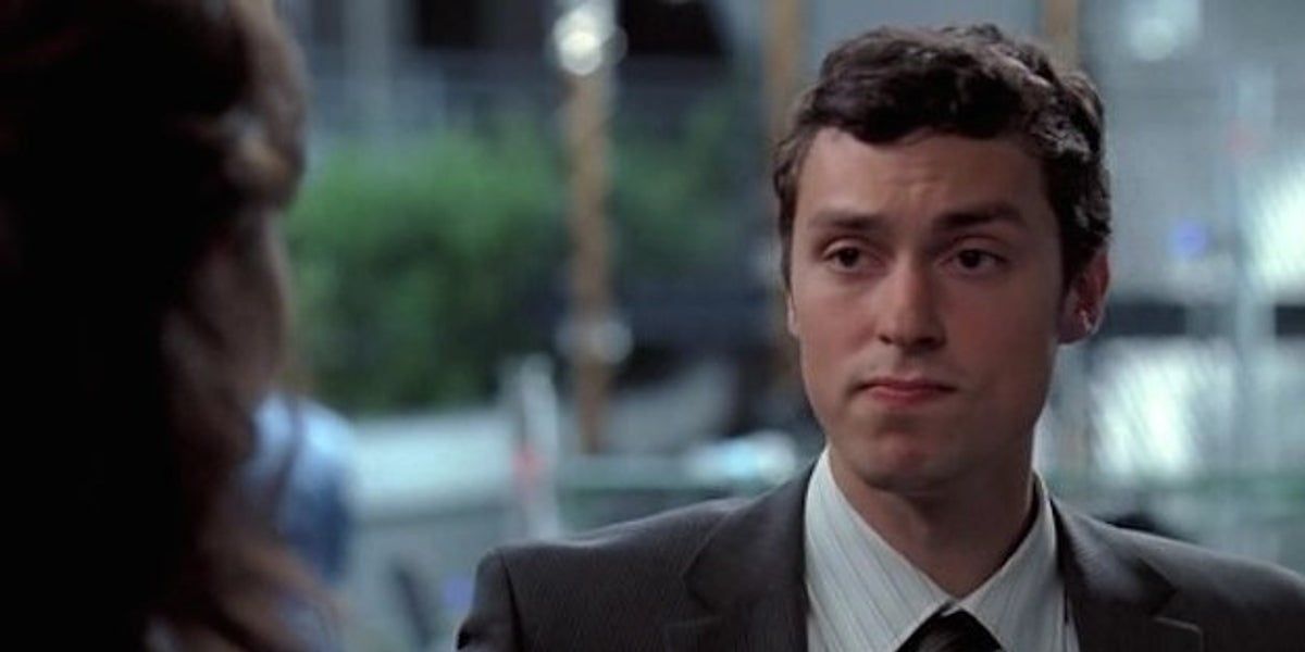John Francis Daley as Lance Sweets wearing a suit scrunching his face in Bones