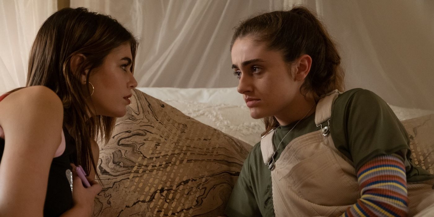 Kaia Gerber and Rachel Sennott looking at each other on the bed in Bottoms