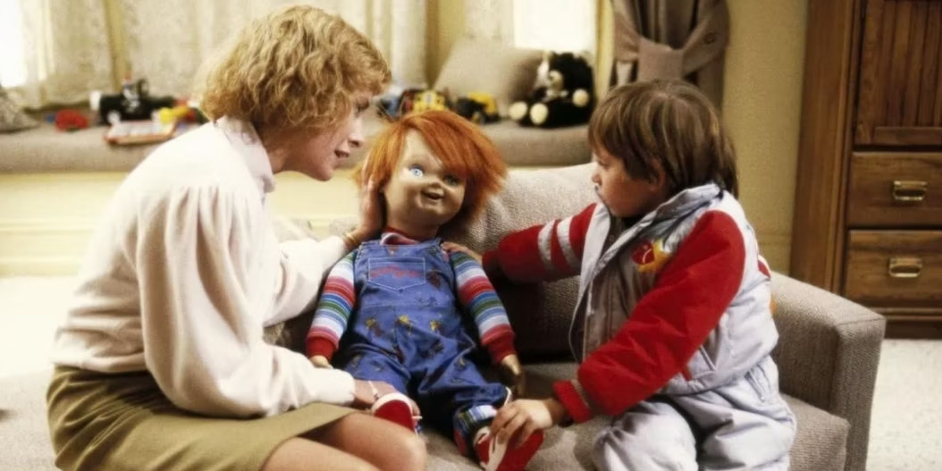 Catherine Hicks as Karen Barclay and Alex Vincent as Andy Barclay with Chucky in Child's Play