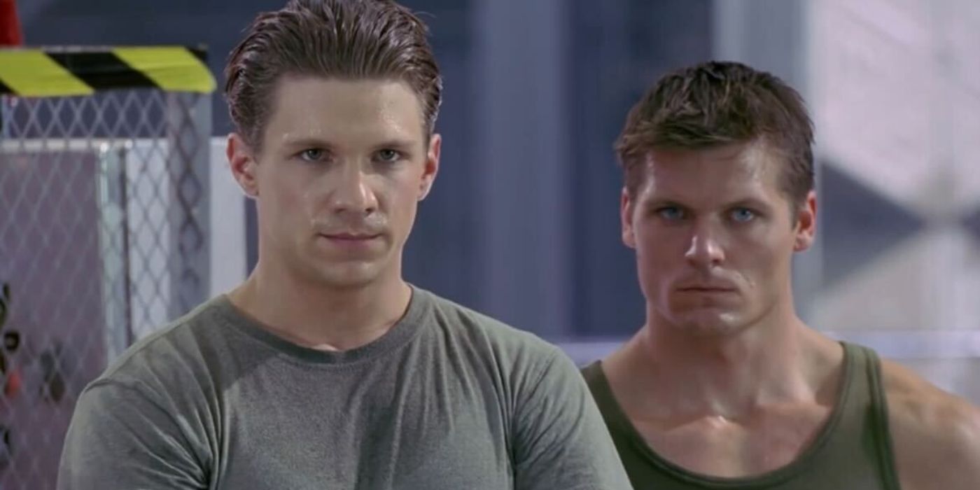 Riley and another person look serious and stare in the same direction in Buffy the Vampire Slayer.