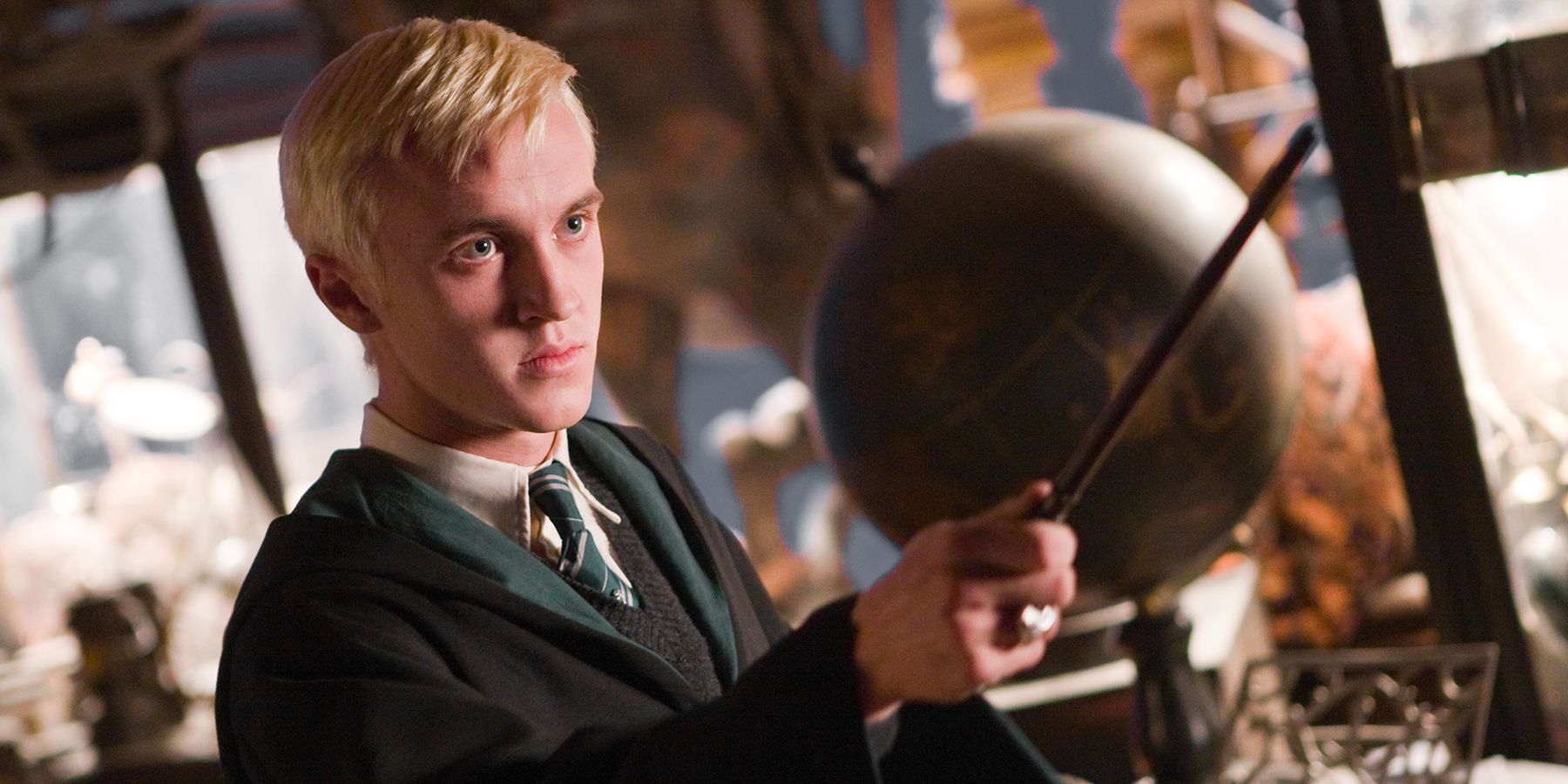 Draco Malfoy (Tom Felton) practices with his wand.