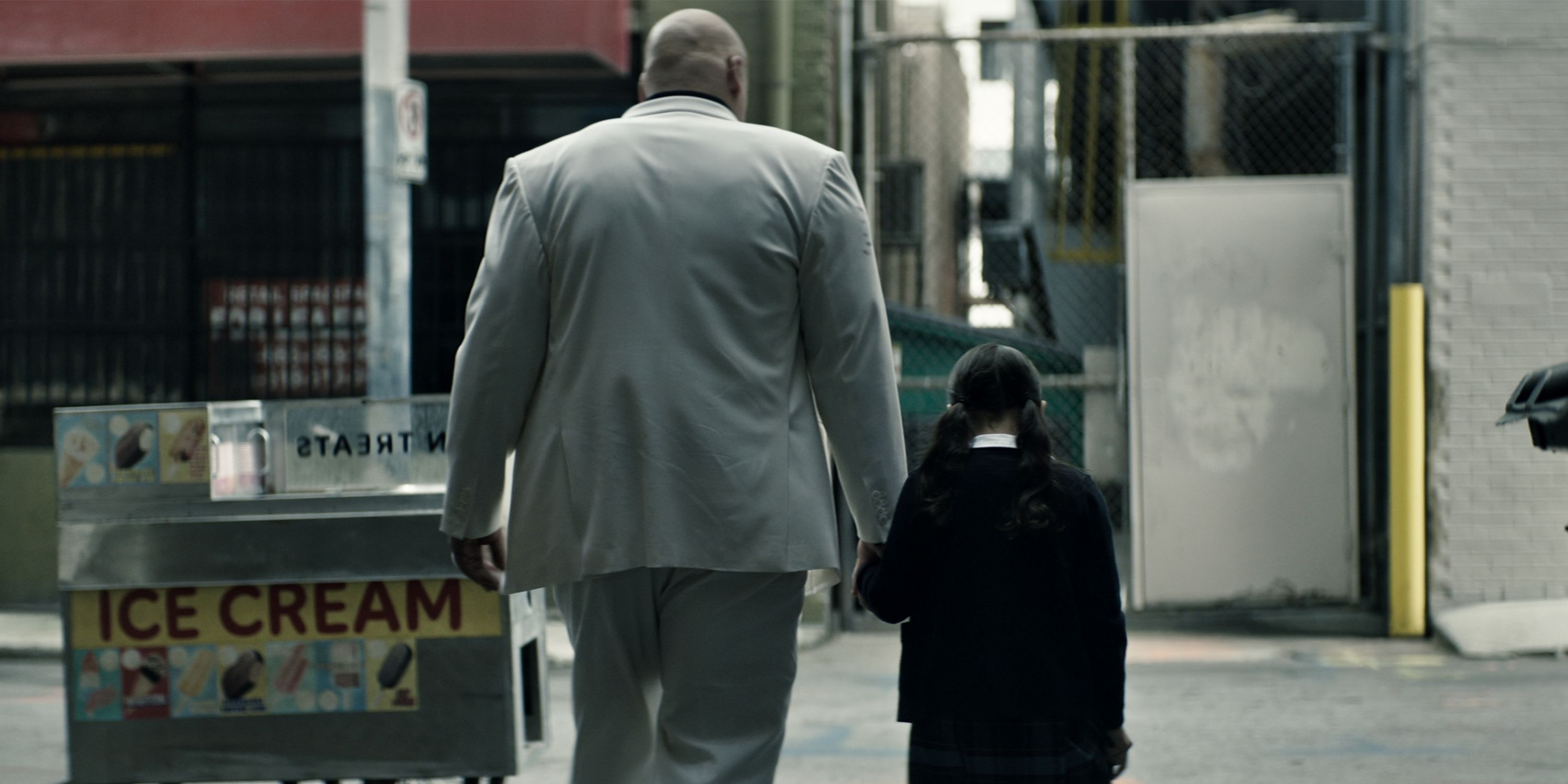 Vincent D'Onofrio as Kingpin with a young Maya Lopez (played by Darnell Besaw) walking away in the Marvel Studios series 'Echo'